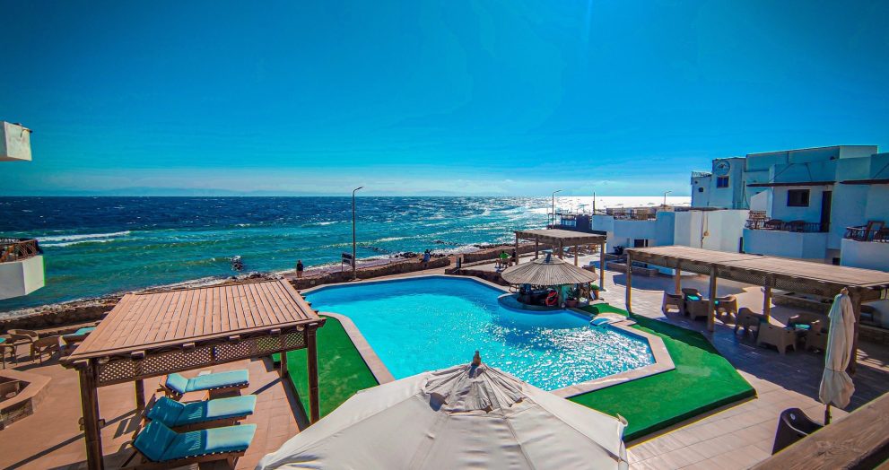 Located on its own private beach, the air-conditioned rooms at Dyarna Dahab Hotel feature a private balcony or patio, an outdoor swimming pool surrounded by sun loungers and a poolside bar, free Wi-Fi and parking