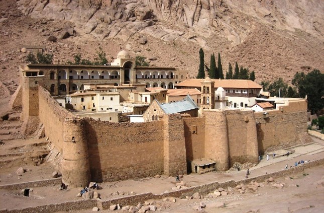 On the slopes of Mount Sinai, where Moses received the Ten Commandments from God, lies one of the oldest operating monasteries in the world. Known as the Monastery of St. Catherine, its actual name is the "Holy Monastery of God of Mount Sinai". It was built by order of the Byzantine emperor Justinian I (527-565 AD) in 548-565 AD to house monks who had been living in the Sinai Peninsula since the fourth century AD.